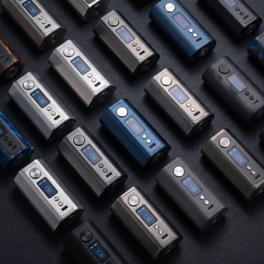 A flat-lay grid of chunky box-mod style AIO vape devices with OLED displays