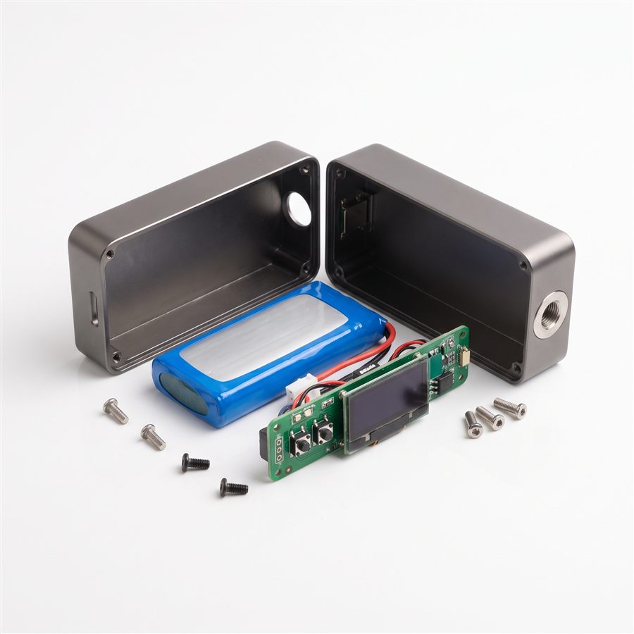 A disassembled AIO vape device showing the built-in battery, OLED display, and circuit board