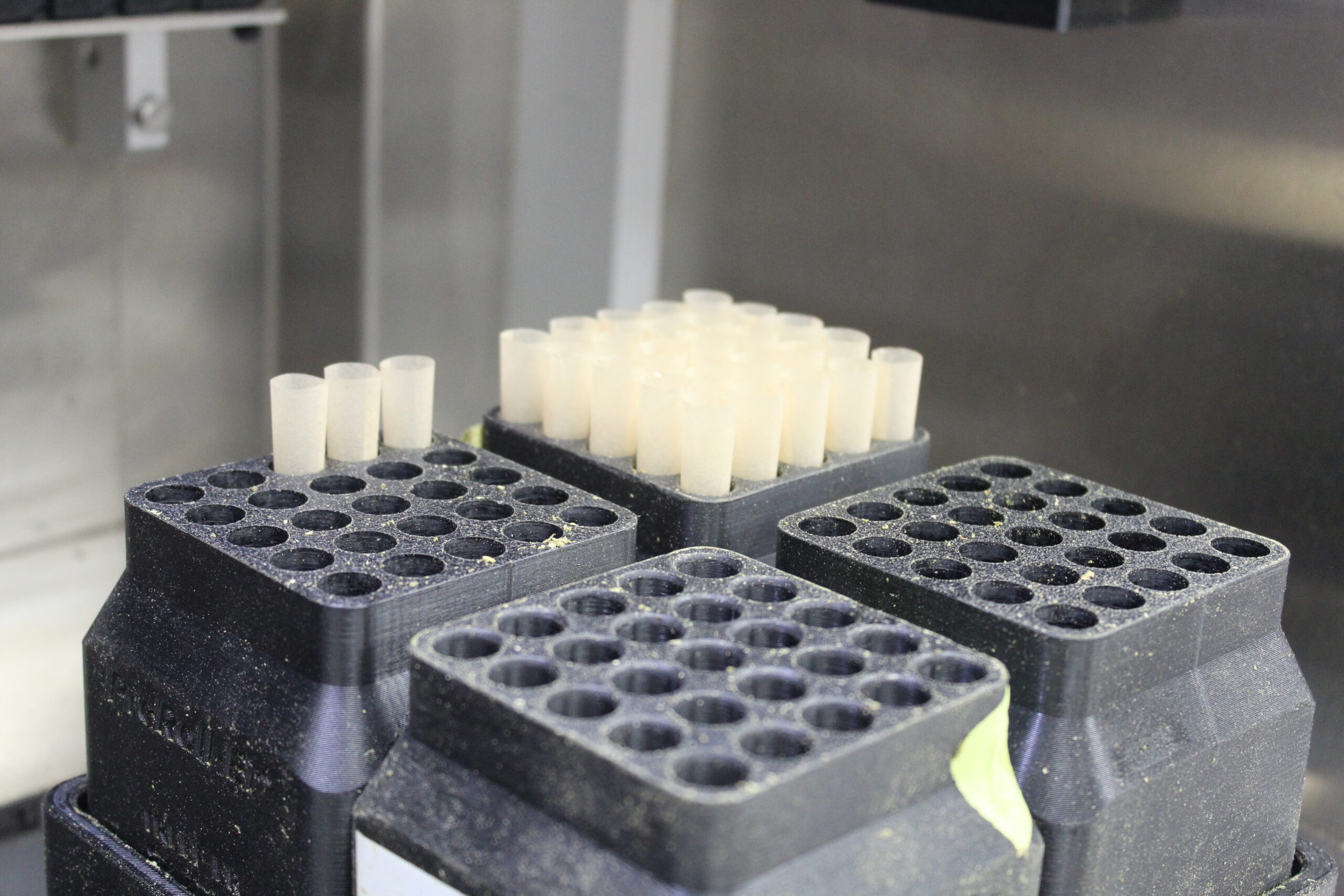 Close-up of pre-roll cones staged in the filling equipment
